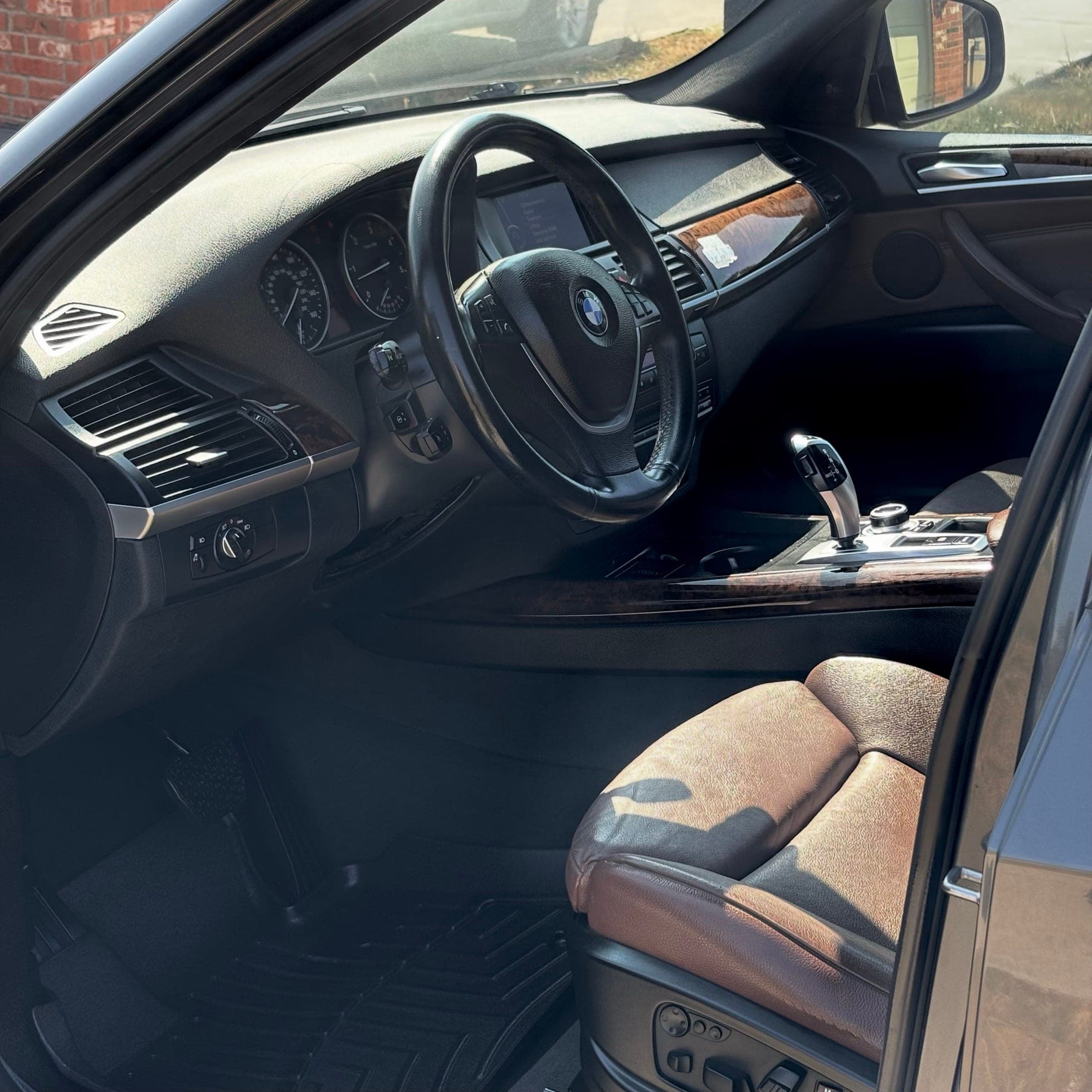 clean bmw cockpit and leather seat after interior care